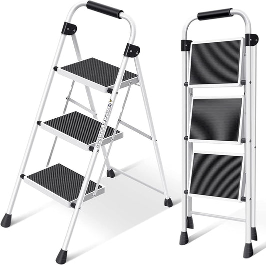 A white 3-step folding ladder with black anti-slip pedals and bracing rods, shown in both open and closed positions.