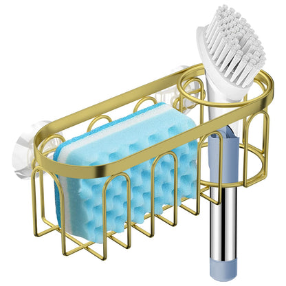 A black stainless steel sponge holder with suction cups attached to a white sink, holding a blue sponge and a dish brush.